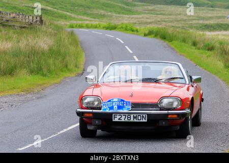 MOFFAT, ÉCOSSE - 29 JUIN 2019 : voiture de sport Jaguar XJS 1988 dans un rallye automobile classique en route vers la ville de Moffat, Dumfries et Galloway Banque D'Images