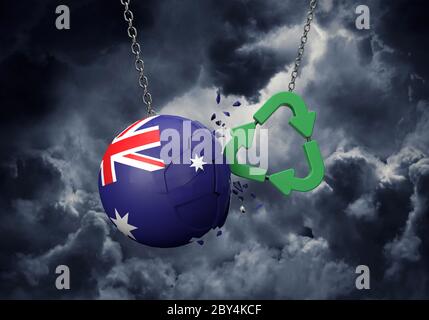 Le symbole de recyclage vert s'écrasant dans une boule de drapeau de l'Australie. Rendu 3D Banque D'Images