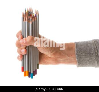 Homme tenant plusieurs crayons de couleur Banque D'Images