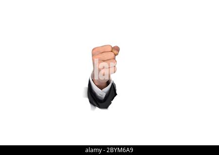 Businessman hand fist brisant le mur de papier Banque D'Images