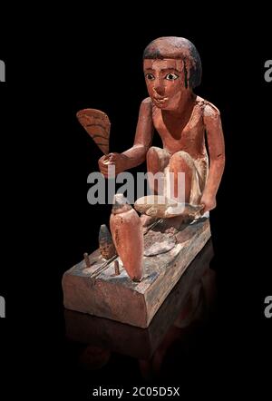 Ancien modèle égyptien en bois d'un homme qui cuisine un canard, Nouveau Royaume, 11-13ème dynastie, (1980-1700 av. J.-C.), Asyut. Musée égyptien, Turin. Cat 8944. Noir Banque D'Images