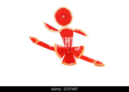Une alimentation saine. Petit danser drôle fait de tranches de pamplemousse. Banque D'Images