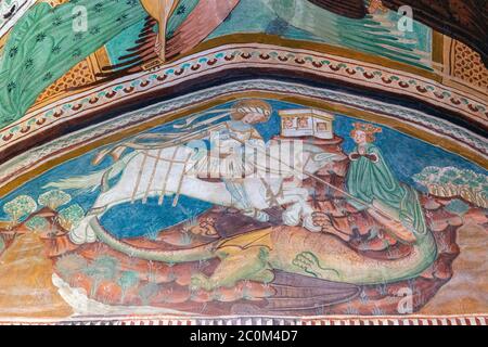 Fresque de Saint-Georges qui lapa le dragon dans l'église romane-gothique de Saint-Jean-Baptiste construite vers 1100 sur les rives du lac Bohinj à l'extérieur Banque D'Images