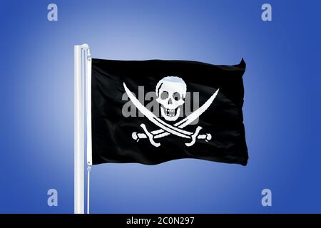 Jolly Roger le drapeau Pirate souffle dans le vent Banque D'Images