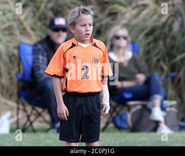 Reese Witherspoon, son mari Jim Toth et son ex-mari Ryan Phillippe regardent leur fils Deacon Phillippe jouer au football à Brentwood, en Californie. Novembre 2012 Banque D'Images