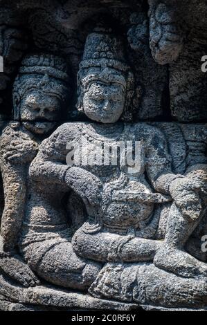 Medidating et coin de la sculpture sur pierre à Borobudur Banque D'Images