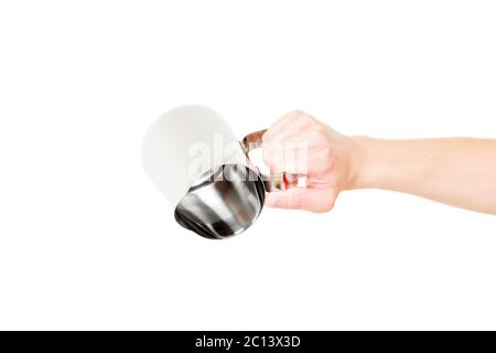 Chaudière en acier inoxydable pot de lait dans la main isolated on white Banque D'Images