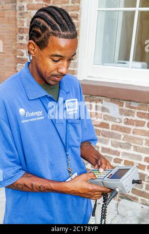 New Orleans Louisiana,Warehouse District,Julia Street,Entergy,lecteur de mètres,travail,travail,personnel des travailleurs employés,Black man hommes hommes adultes, Banque D'Images