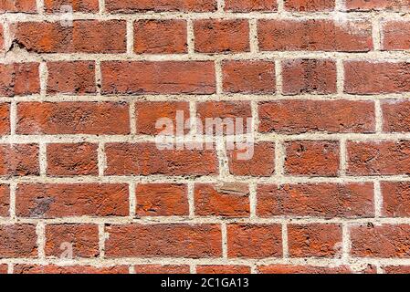 Arrière-plan d'un mur de brique rouge profond Banque D'Images