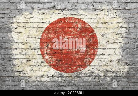 Grunge affligé d'un drapeau japonais peint sur old weathered gray brick wall Banque D'Images