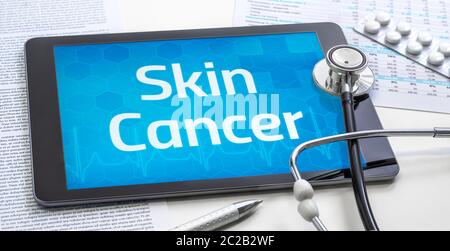 Le mot Cancer de la peau à l'écran d'une tablette Banque D'Images