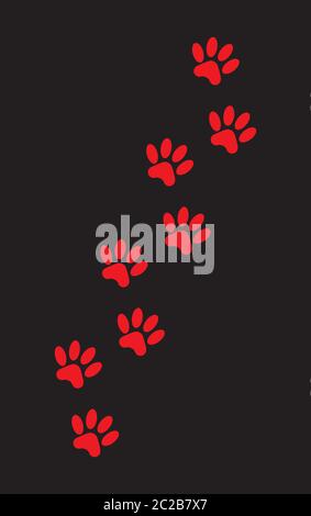 Un ensemble d'empreintes de pattes de chien en rouge sur noir Banque D'Images