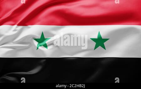 Brandissant le drapeau national de la Syrie Banque D'Images