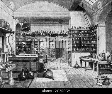 Faraday dans son laboratoire à la Royal institution de Londres, illustration gravée d'époque. De l'Univers et de l'humanité, 1910. Banque D'Images