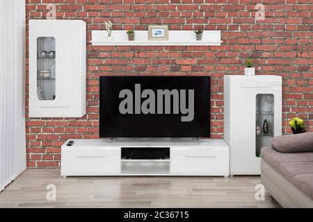 Mettre en valeur l'intérieur et d'une télévision LCD à écran plat à l'intérieur moderne salle de séjour Banque D'Images