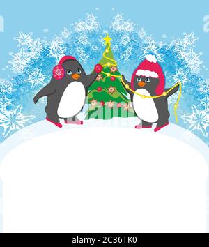 Pingouins drôle decorating Christmas Tree Banque D'Images