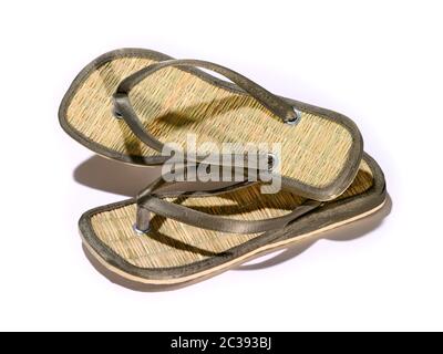 sandales à la main tongs isolées sur blanc Banque D'Images