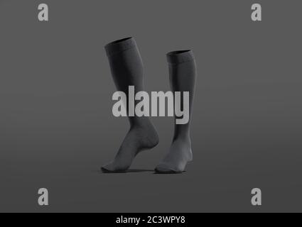 Paire noire vierge chaussettes de football mockup bout, fond sombre Banque D'Images