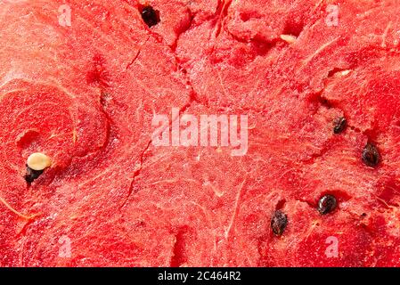 Pastèque juteuse, mûre, douce. Abstrait rouge pastèque fraîche texture détaillée de fond. Banque D'Images