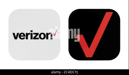 Kiev, Ukraine - 02 novembre 2019: Verizon, anciennes et nouvelles icônes imprimées sur le livre blanc. Verizon Communications est une multinationale américaine telecica Banque D'Images