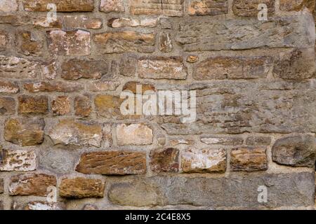 Grunge mur en pierre de brique ancienne de couleur beige clair. Texture abstraite ou arrière-plan Banque D'Images