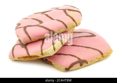 gâteaux fraîchement cuits, roses, avec sauce au chocolat sur fond blanc Banque D'Images