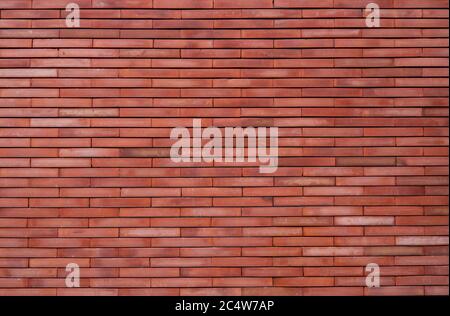 Fond de texture de mur en brique orange. Fond d'écran orange vintage. Mur de briques vide. Fond de mur en brique de couleur orange. Intérieur du mur d'intérieur. Banque D'Images