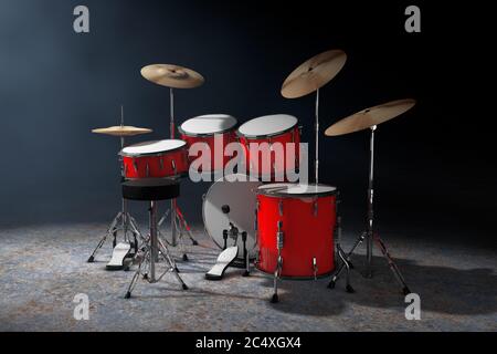 Kit de tambour rouge rock professionnel dans la lumière volumétrique sur fond noir. Rendu 3d Banque D'Images