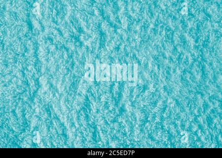 Texture de fond en tissu turquoise. Tissu éponge texturé gros plan. Banque D'Images