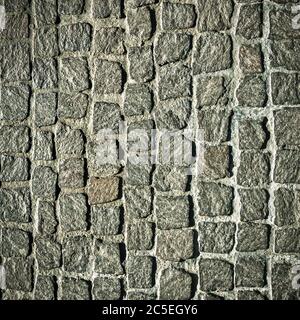 Fond de texture de chaussée pavé. Détail du trottoir en granit. Vue de dessus de la route en pierre. Des pavés carrés ou de rue pour toile de fond. Pavillon vintage Banque D'Images