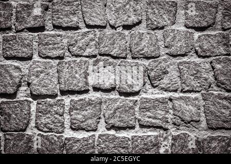 Fond de texture de chaussée pavé. Détail du trottoir en granit. Vue de dessus de la route en pierre. Chaussée d'époque avec blocs rugueux. Rue pavés i Banque D'Images