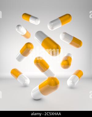 Capsules de médicaments volant orange et blanc, sur fond blanc. Illustration 3D Banque D'Images