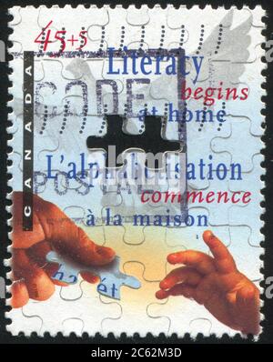CANADA - VERS 1996 : timbre imprimé par le Canada, montre l'alphabétisation, vers 1996 Banque D'Images