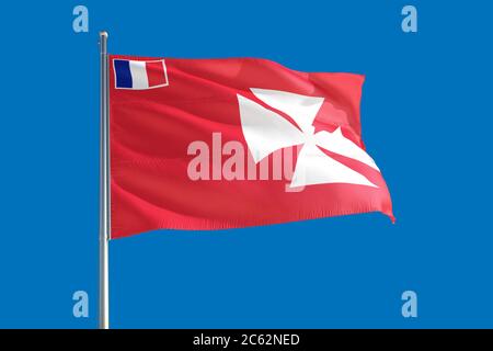 Le drapeau national de Wallis et Futuna agitant dans le vent sur un ciel bleu profond. Tissu de haute qualité. Concept de relations internationales. Banque D'Images