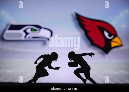 Seattle Seahawks contre Arizona Cardinals . Affiche NFL Match. Deux joueurs de football américain se font face sur le terrain. Logo des clubs à l'arrière Banque D'Images