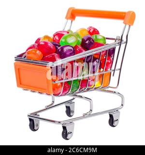 Chariot avec bonbons colorés. Isolé sur blanc Banque D'Images
