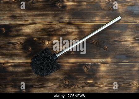 brosse de toilette sur fond de bois. arbre à feu Banque D'Images