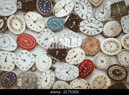 Old fashioned retro little wrist watch rusty dials with hands top view background Banque D'Images