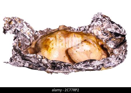 Délicieux poulet grillé sur du papier d'aluminium blanc Banque D'Images