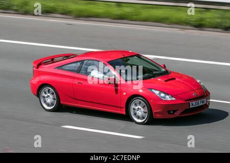 A 2006 Toyota Celica T Sport Vvtli Red car coupé essence conduite sur l'autoroute M6 près de Preston à Lancashire, Royaume-Uni Banque D'Images