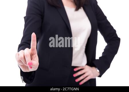 femme d'affaires touchant l'écran imaginaire ou appuyant sur le bouton avec son doigt isolé sur fond blanc Banque D'Images