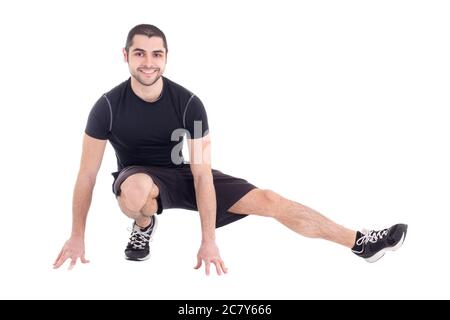 beau barbu arabe homme dans les vêtements de sport s'étendant isolé sur fond blanc Banque D'Images