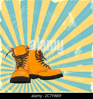 Une paire de bottes à la main sur un fond grunge. Banque D'Images