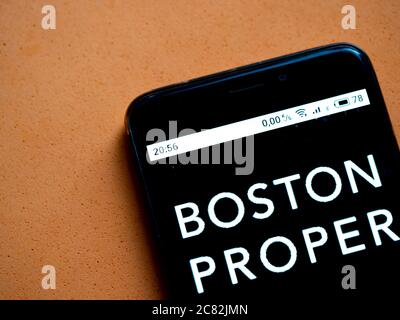 In this photo illustration a Boston Proper logo is seen displayed on a smartphone. Banque D'Images