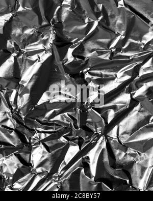 Texture de papier d'aluminium doré froissé. Arrière-plan abstrait pour la conception. Banque D'Images