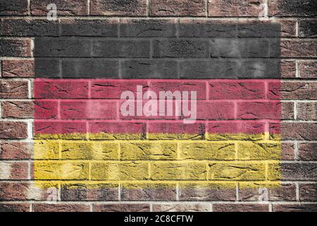 Drapeau allemand peint sur fond de mur de briques Banque D'Images