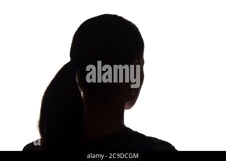 Silhouette d'une jeune fille à partir du dos avec une mèche de cheveux - isolée, non-apyée Banque D'Images