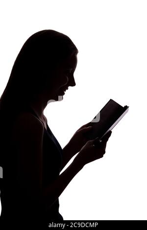 Fille a lu un livre - silhouette, isoler Banque D'Images