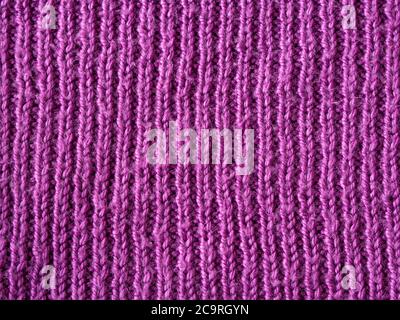 rose vif laine lilas main tricoté texture résumé fond Banque D'Images