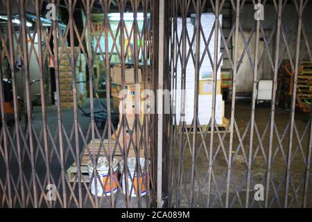 asian rustiness chinese traditional gate or folding doors in the shop with the vintage style - architectural structure in Yau Ma Tei Wholesale Fruit M Stock Photo